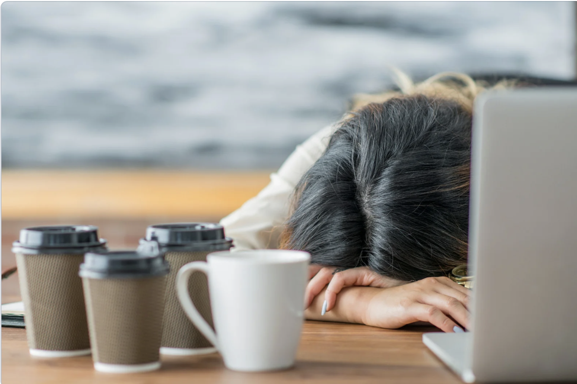 Woman Exhausted at computer